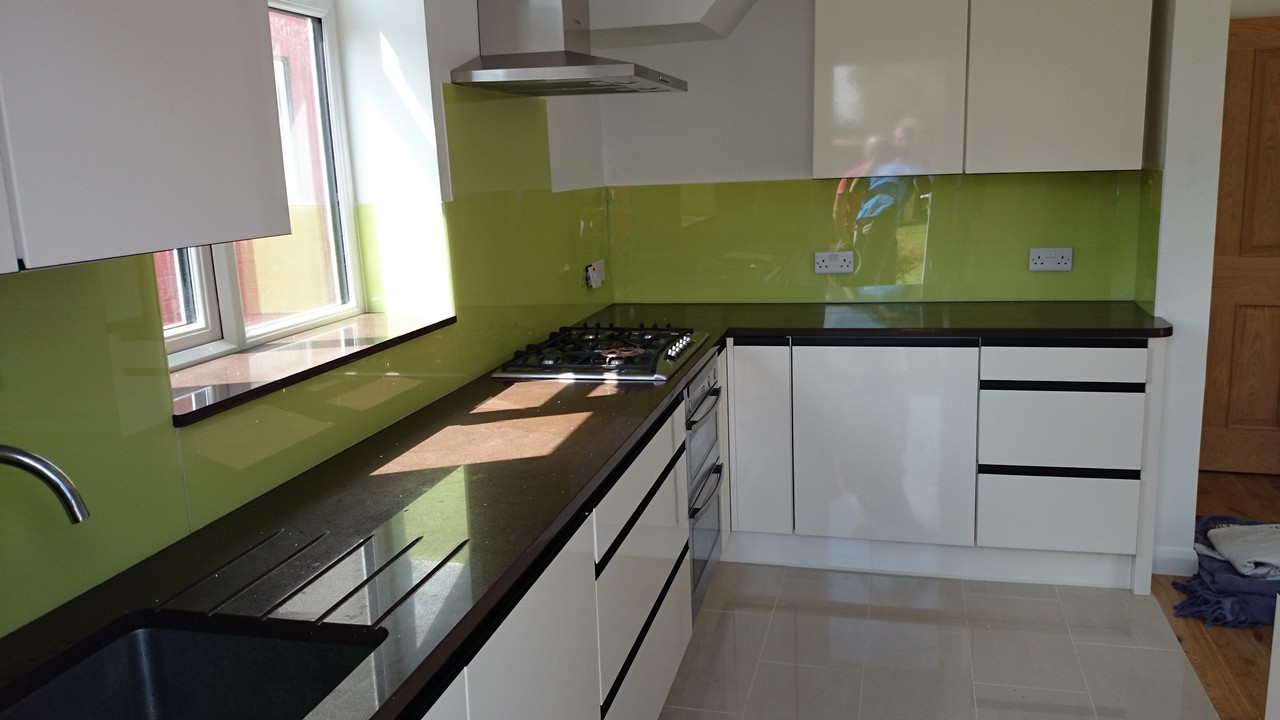 Lime green glass kitchen splashback installed by Feltham glaziers