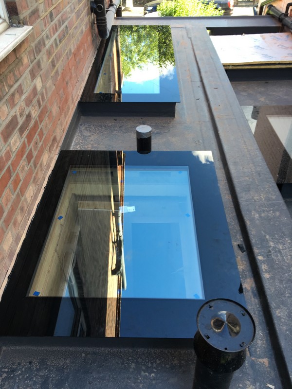 Multiple flat roof skylights on extension in Feltham