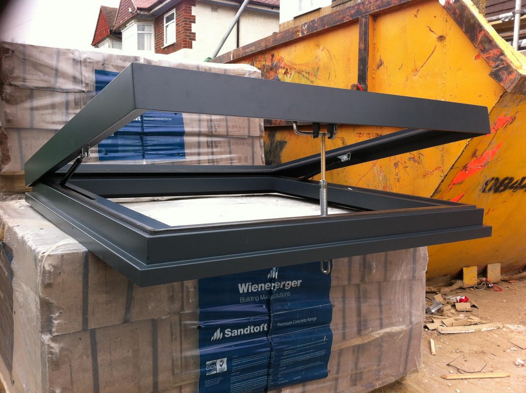 Opening flat roof skylight in anthracite grey installed in Feltham